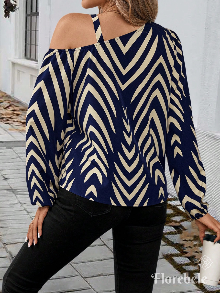 BLUSA CON CUELLO ASIMÉTRICO ESTAMPADA