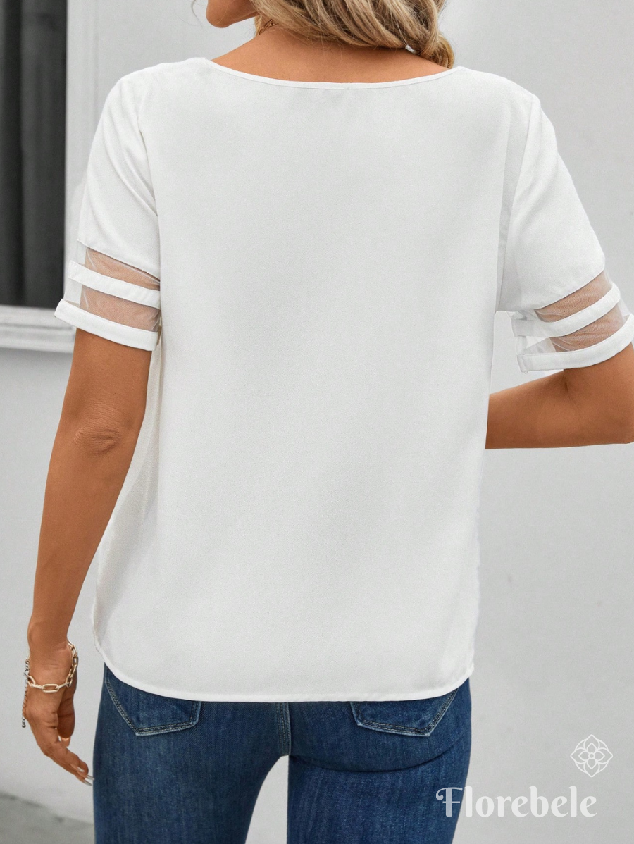 BLUSA CON DETALLE DE TRANSPARENCIA