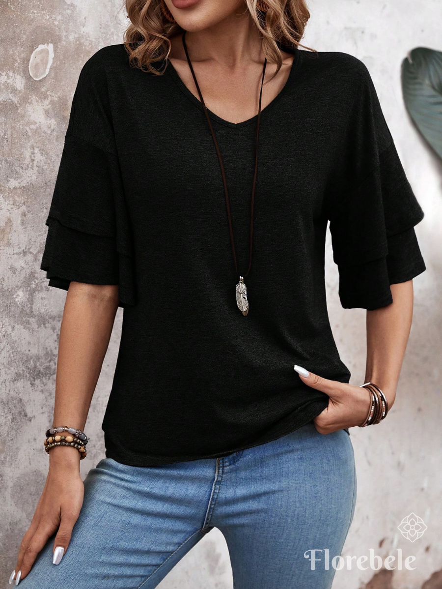 BLUSA CON MANGAS DE VOLANTES
