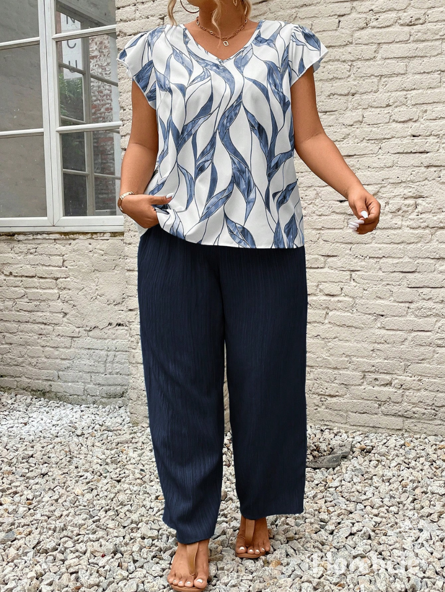 CONJUNTO CON BLUSA ESTAMPADA Y LAZO