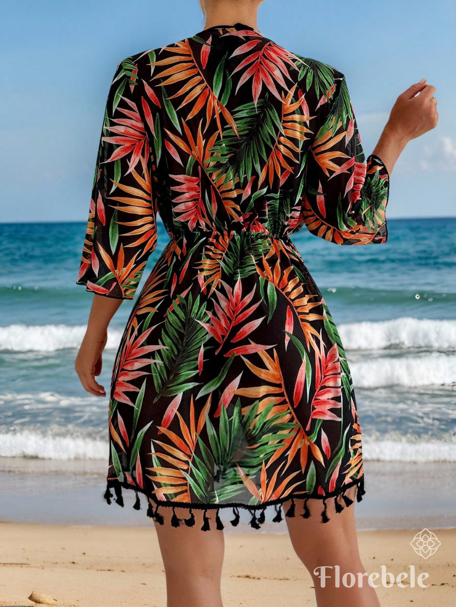 SALIDA DE PLAYA CON ESTAMPADO TROPICAL Y AJUSTE EN CINTURA