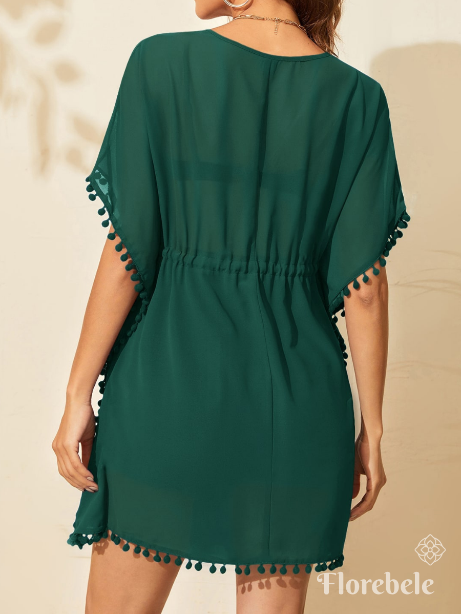 SALIDA DE PLAYA CON POMPONES Y CINTURA AJUSTABLE