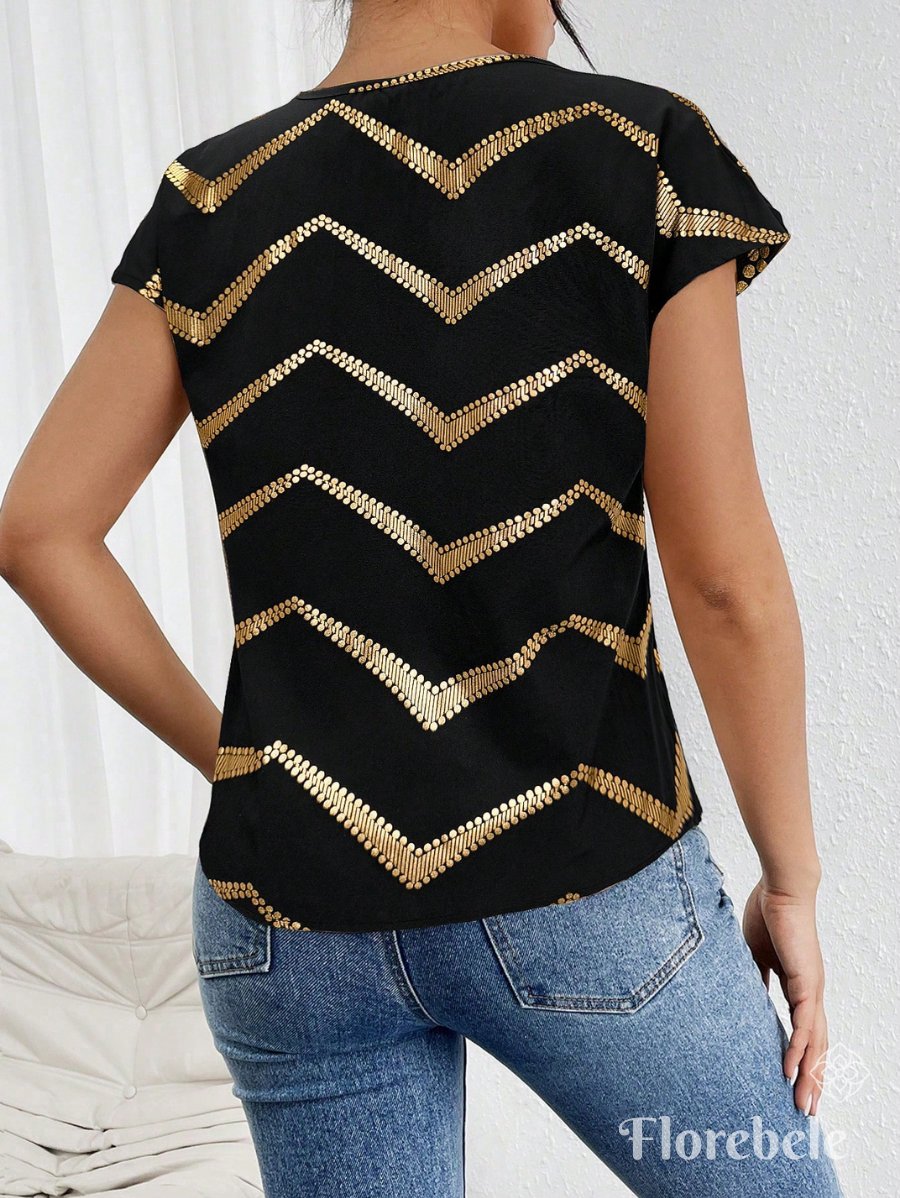 BLUSA CON ESTAMPADO DORADO