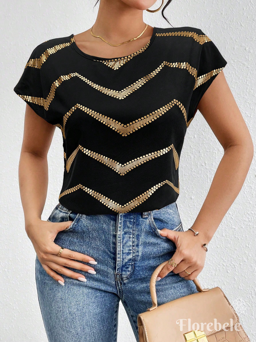 BLUSA CON ESTAMPADO DORADO