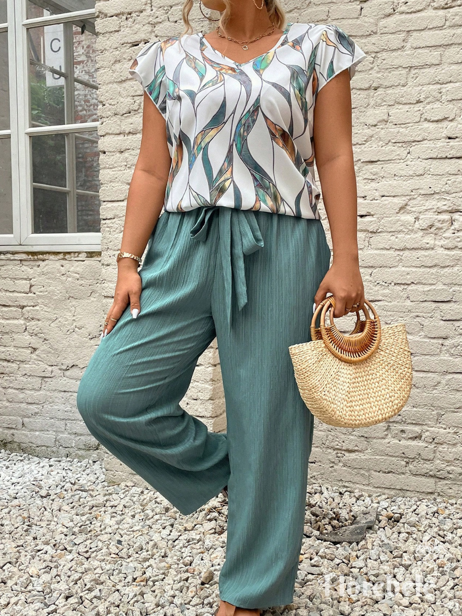 CONJUNTO CON BLUSA ESTAMPADA Y LAZO